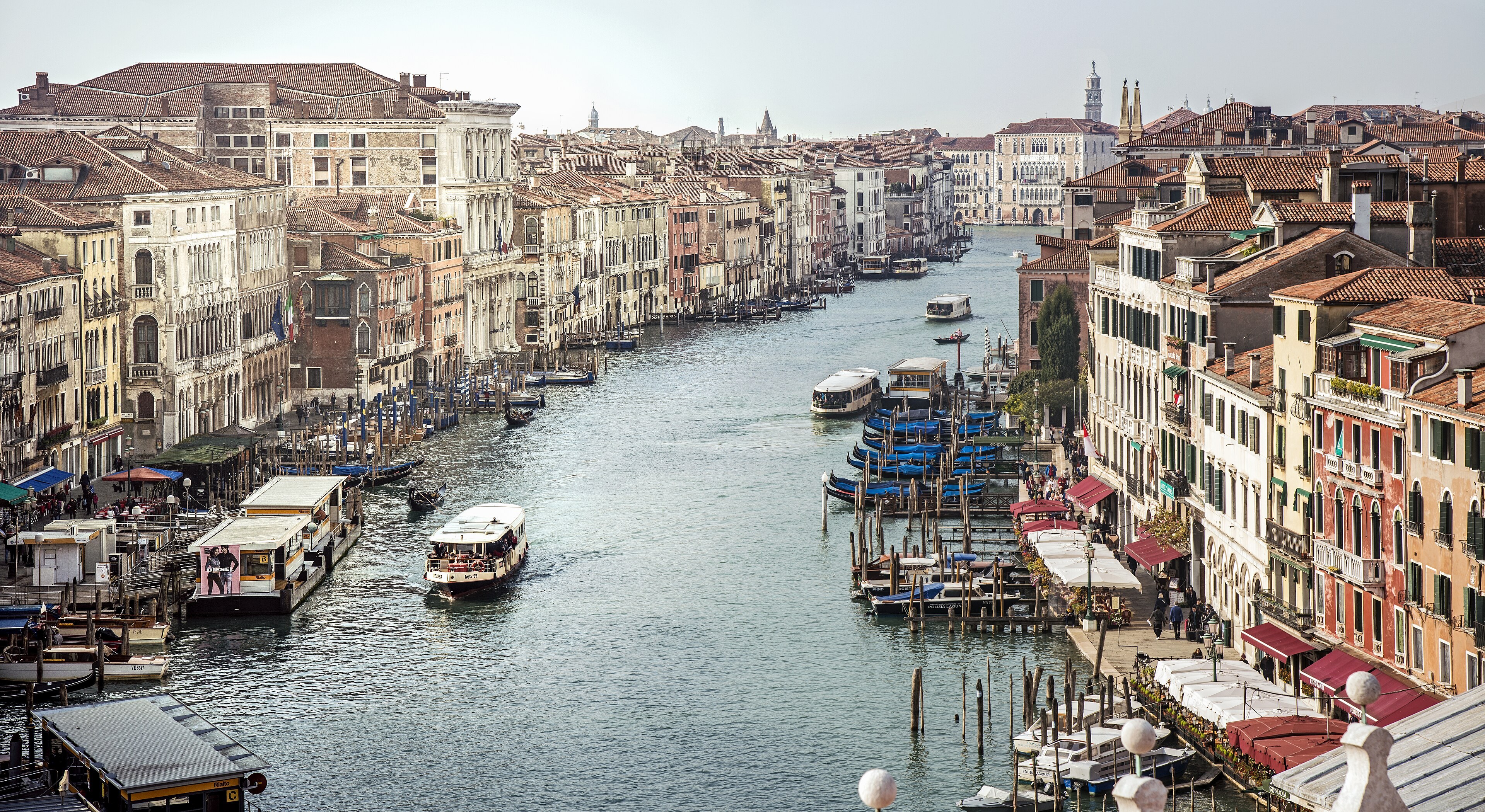 The Grand Canal seen from the Rialto bridge toward Ca' Foscari, lined with palaces and mooring poles